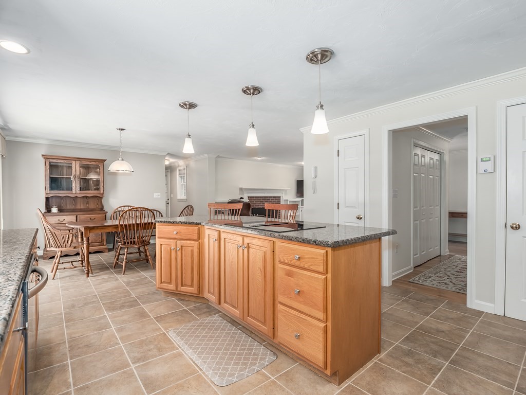 76 Williams Way Rochester, MA 02770 - Photo 8 of 42 a kitchen with stainless steel appliances kitchen island granite countertop a sink and cabinets