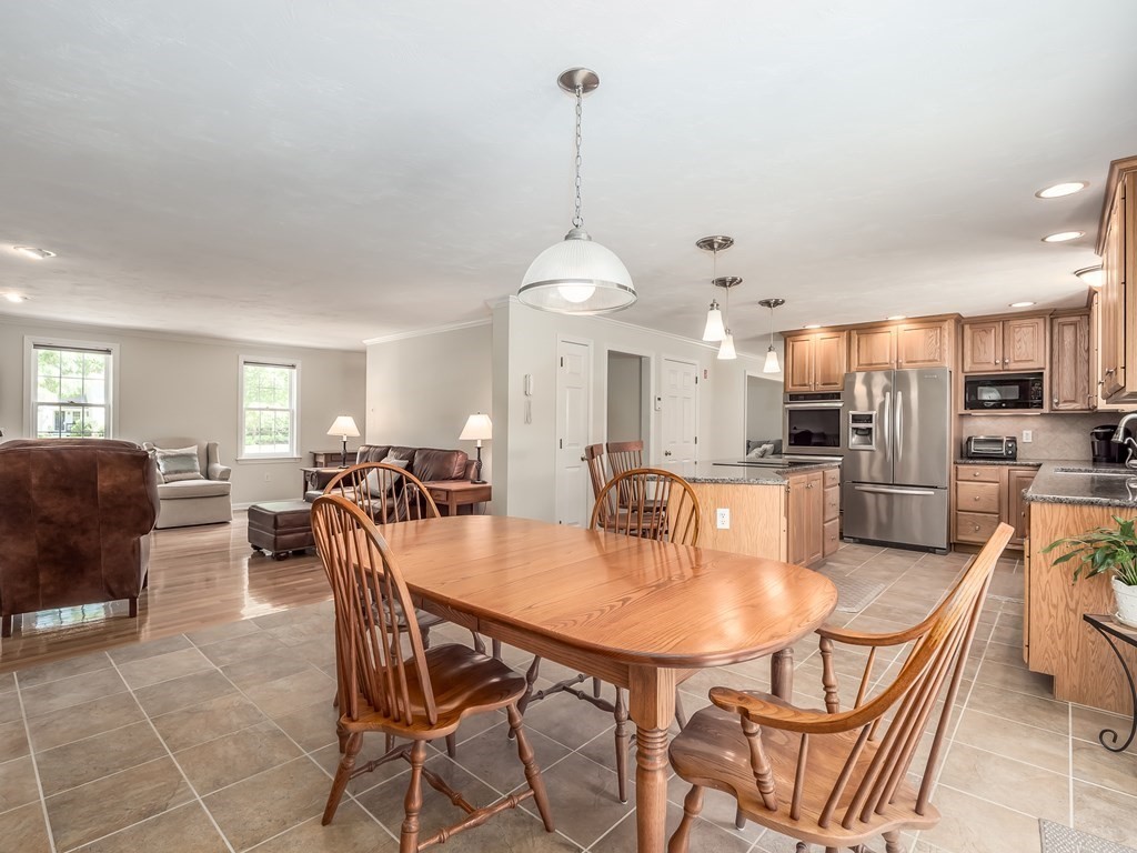 76 Williams Way Rochester, MA 02770 - Photo 9 of 42 a dining room with furniture a window and kitchen view