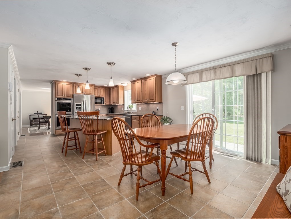 76 Williams Way Rochester, MA 02770 - Photo 10 of 42 a view of a dining room with furniture and chandelier