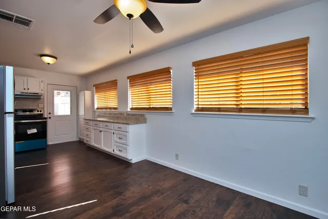 a room with hard wood floor and a window