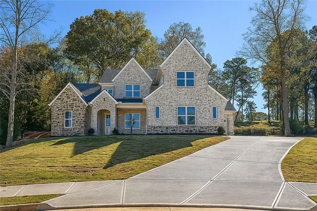 a view of a house with swimming pool and porch