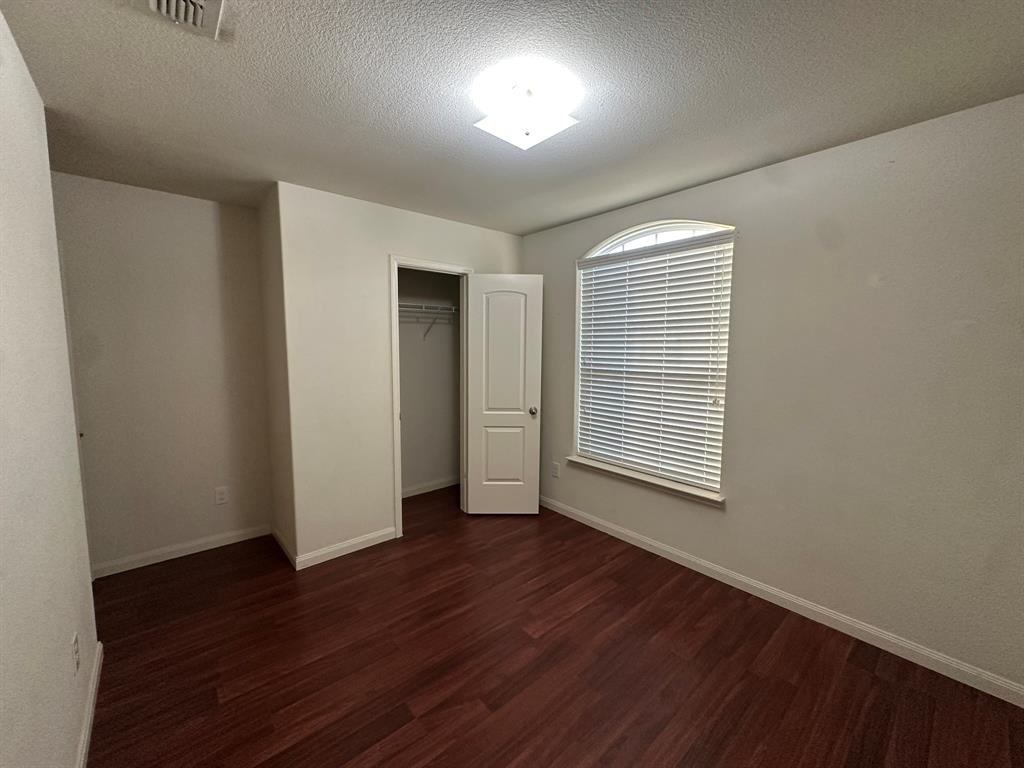 1818 Clegg Street Howe, TX 75459 - Photo 5 of 34 Room with rich wood-finish flooring and light-toned walls
