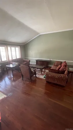 a living room with furniture window and a fireplace