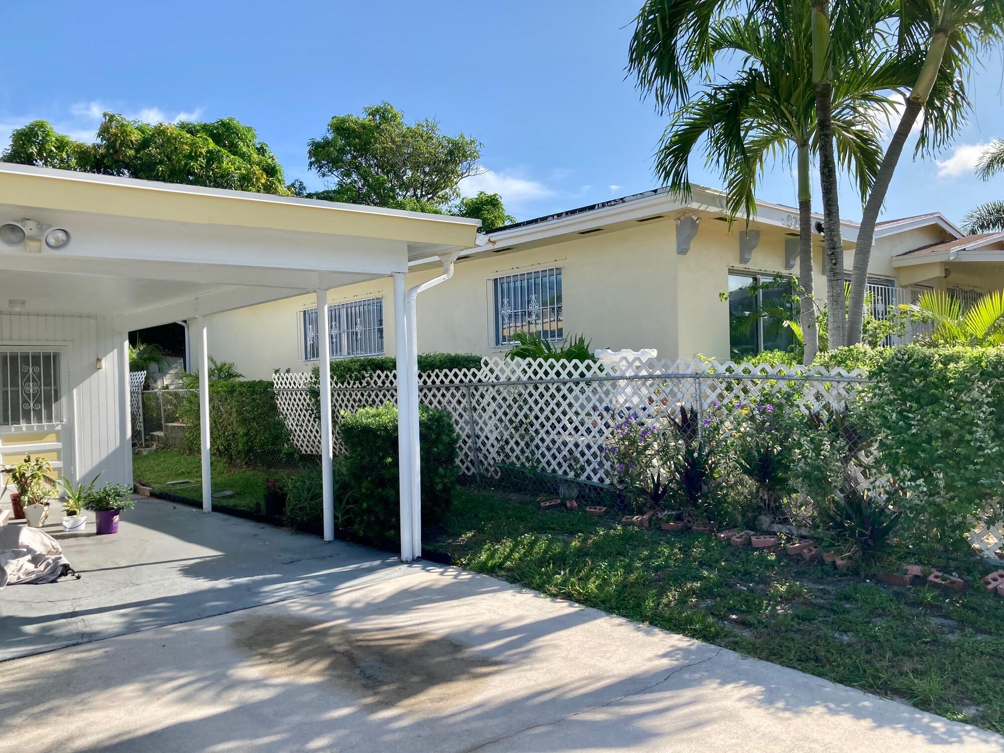 928 West 6th Street Riviera Beach, FL 33404 - Photo 7 of 23 9286thfrontyard1andcarport