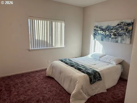 a view of an empty room with a cabinet