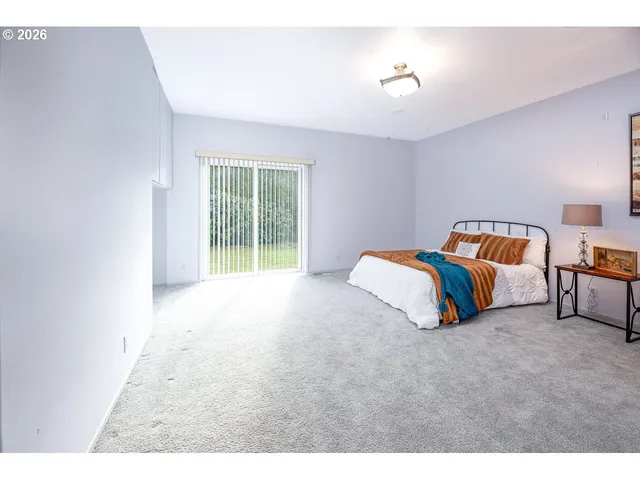 a bathroom with a shower a toilet and a sink