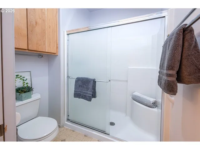 a view of house with backyard and a patio