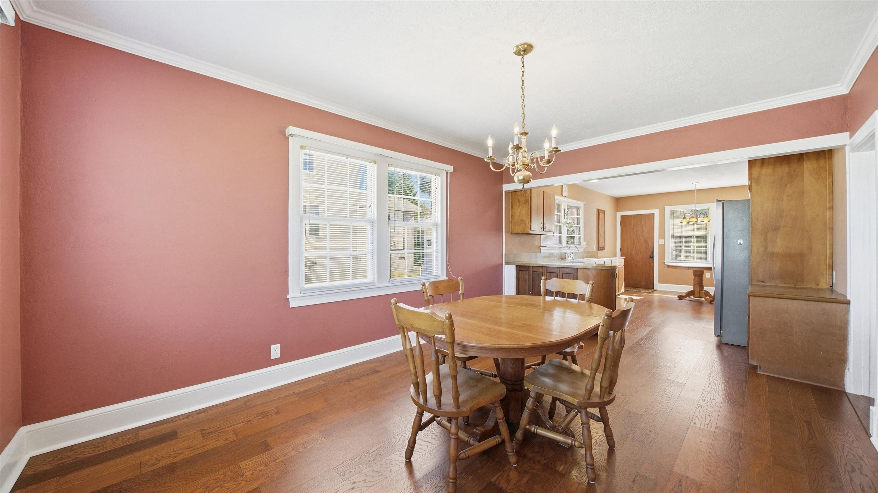 196 Inlet Drive St. Augustine, FL 32080 - Photo 12 of 52 a dining room with furniture a chandelier and wooden floor