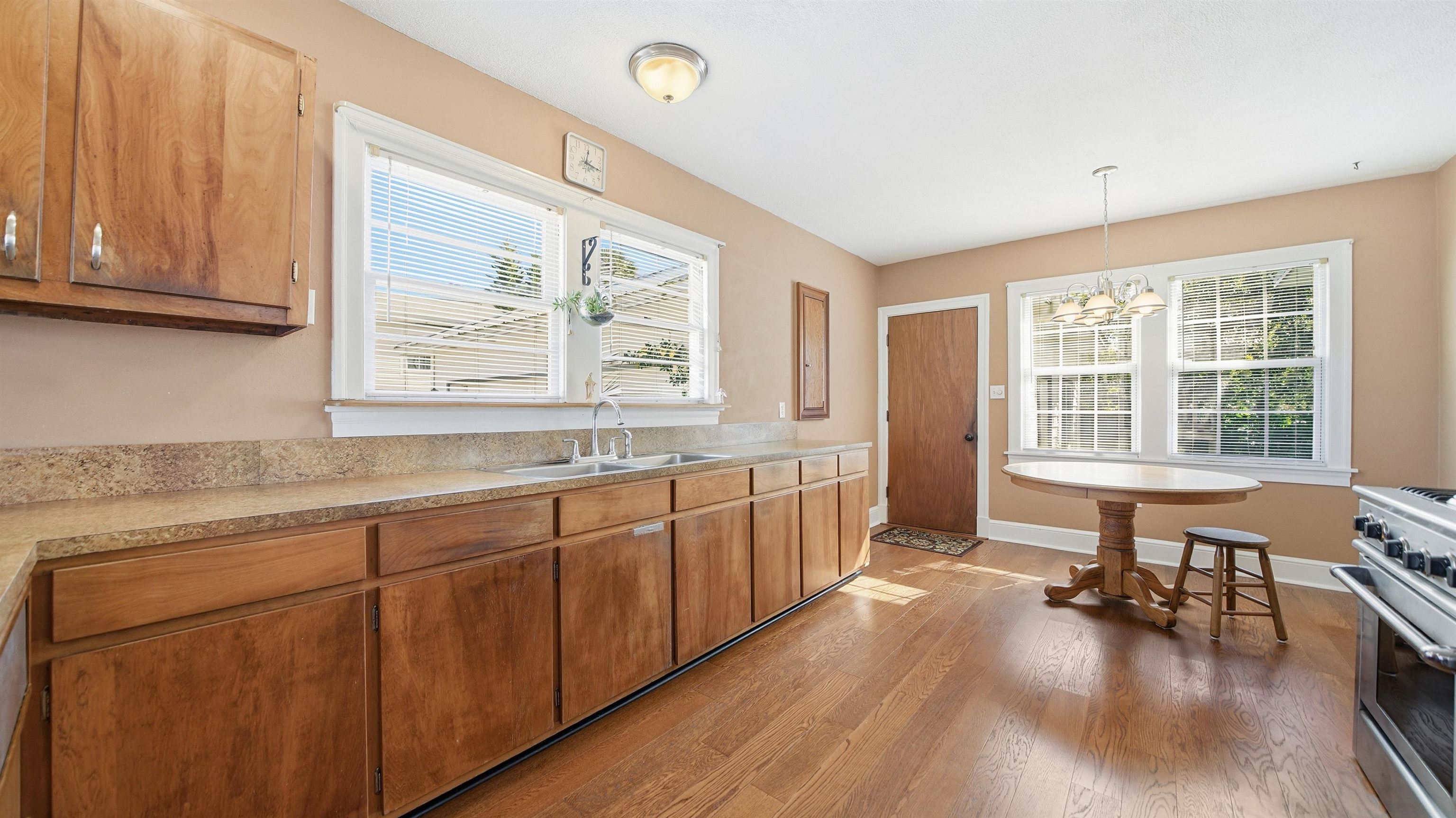 196 Inlet Drive St. Augustine, FL 32080 - Photo 14 of 52 a large kitchen with granite countertop a large window and white cabinets