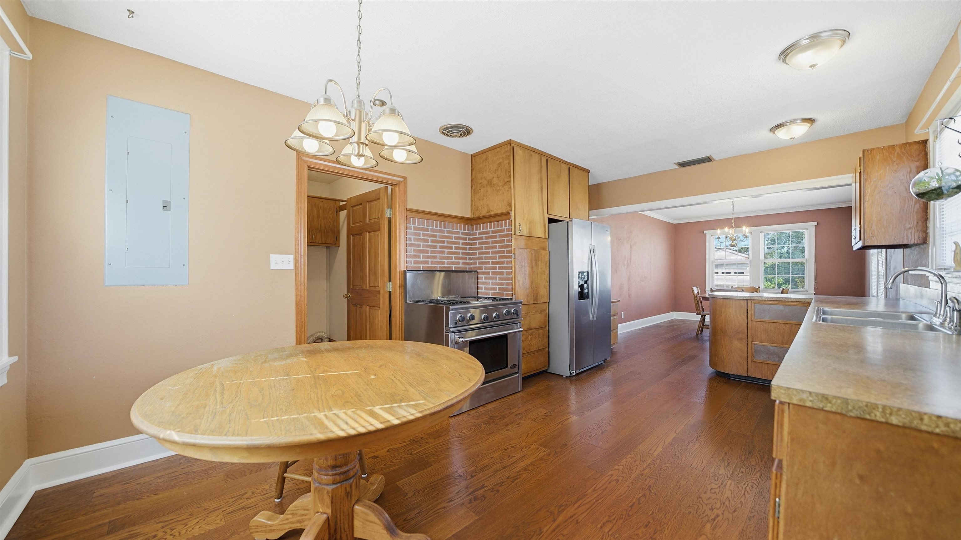 196 Inlet Drive St. Augustine, FL 32080 - Photo 16 of 52 a view of a dining room with furniture wooden floor and chandelier