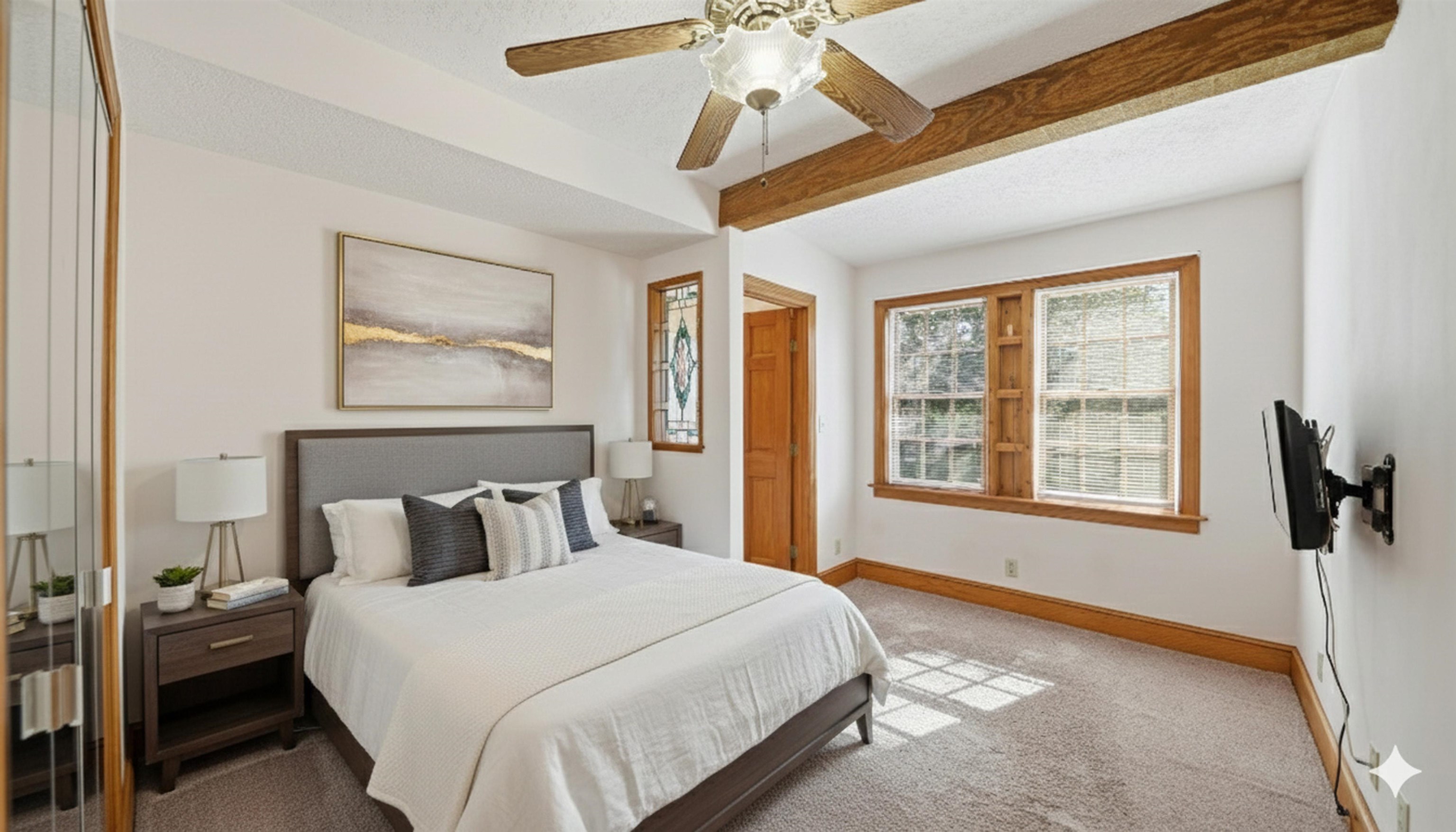 196 Inlet Drive St. Augustine, FL 32080 - Photo 19 of 52 a bedroom with a bed and a chandelier