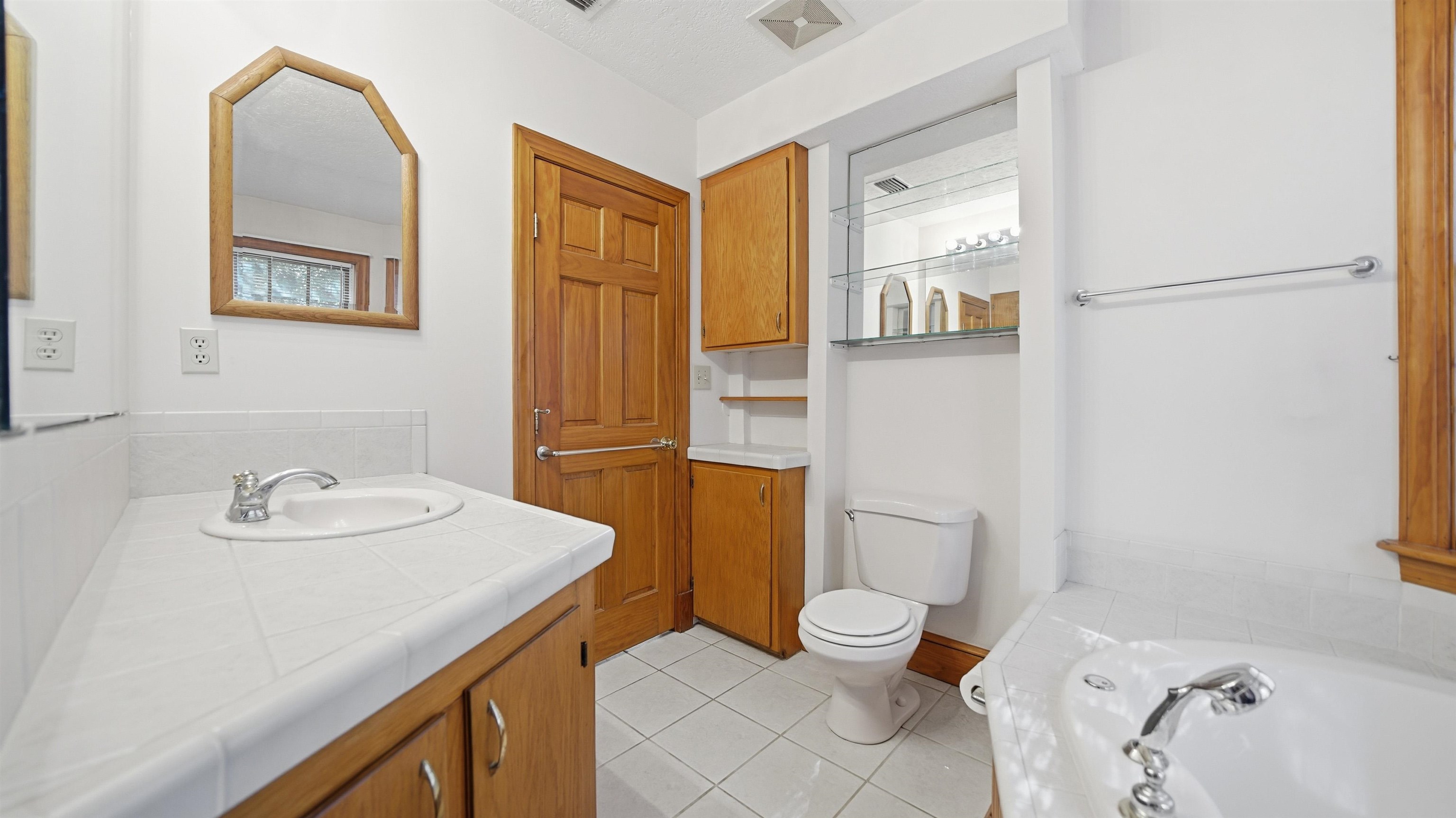 196 Inlet Drive St. Augustine, FL 32080 - Photo 23 of 52 a bathroom with a sink toilet and shower