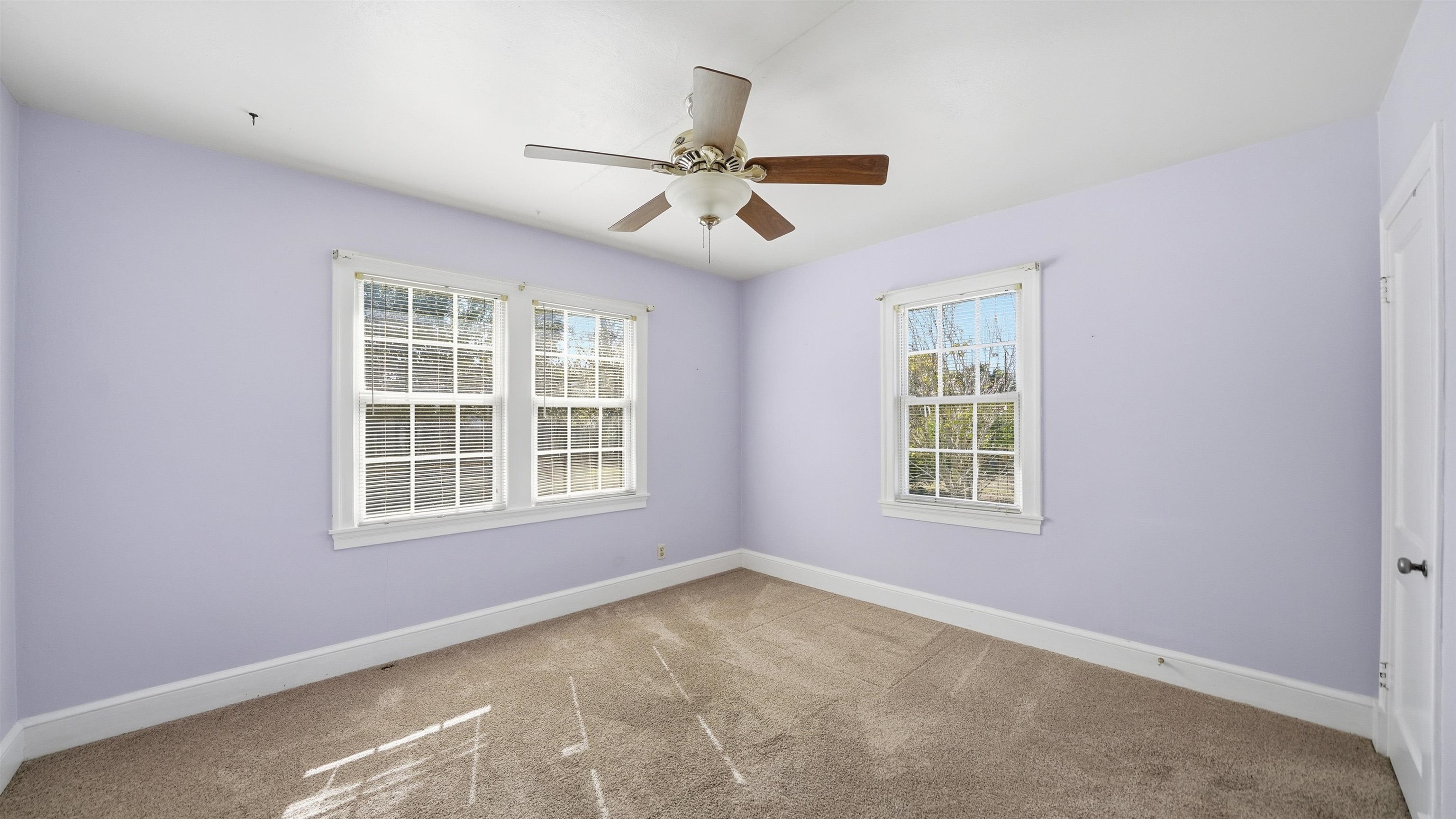 196 Inlet Drive St. Augustine, FL 32080 - Photo 27 of 52 an empty room with windows and fan