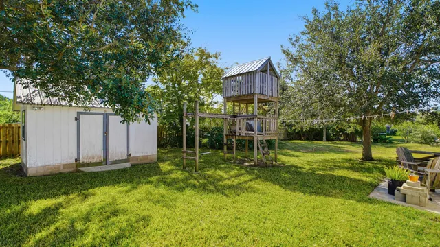 a view of a backyard with a garden