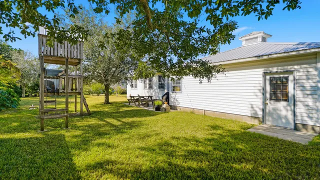 a house view with swimming pool