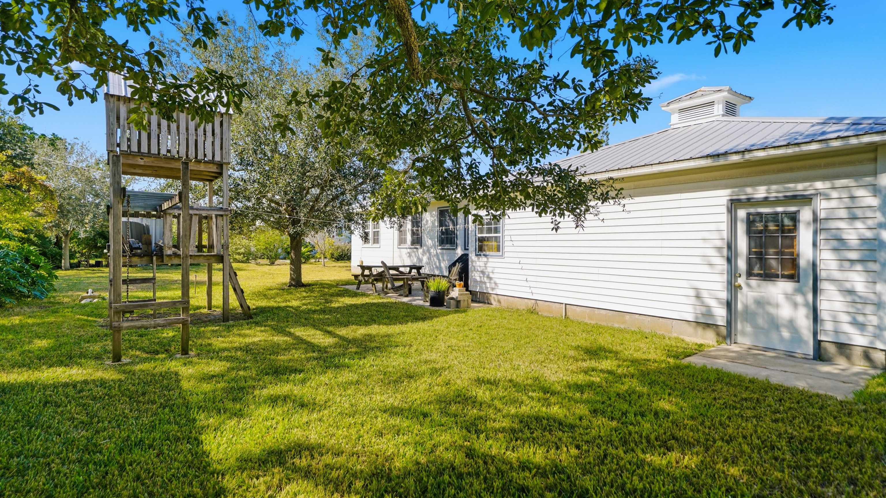 196 Inlet Drive St. Augustine, FL 32080 - Photo 38 of 52 a view of a backyard with a garden