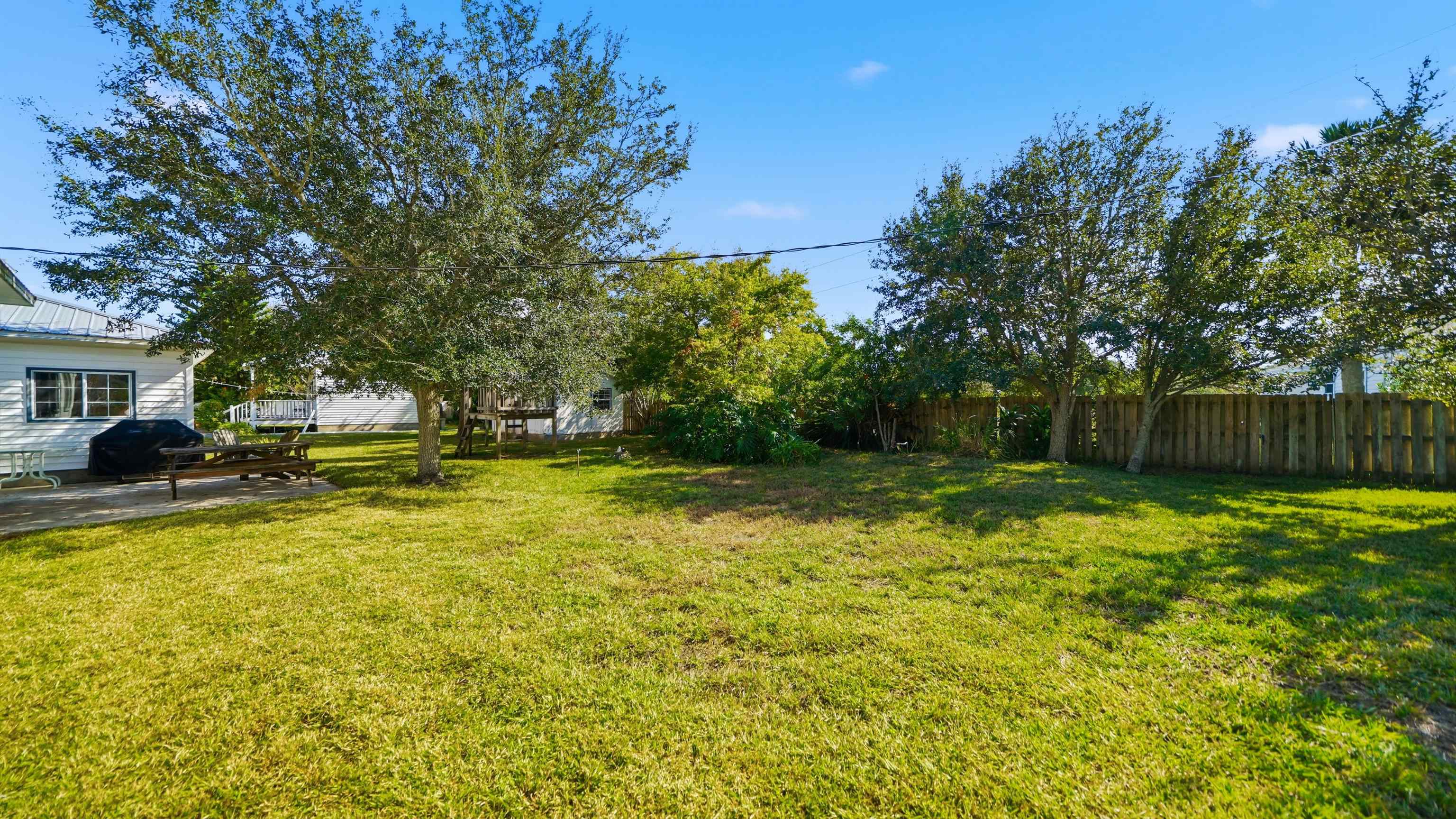 196 Inlet Drive St. Augustine, FL 32080 - Photo 40 of 52 a swimming pool with outdoor seating and yard