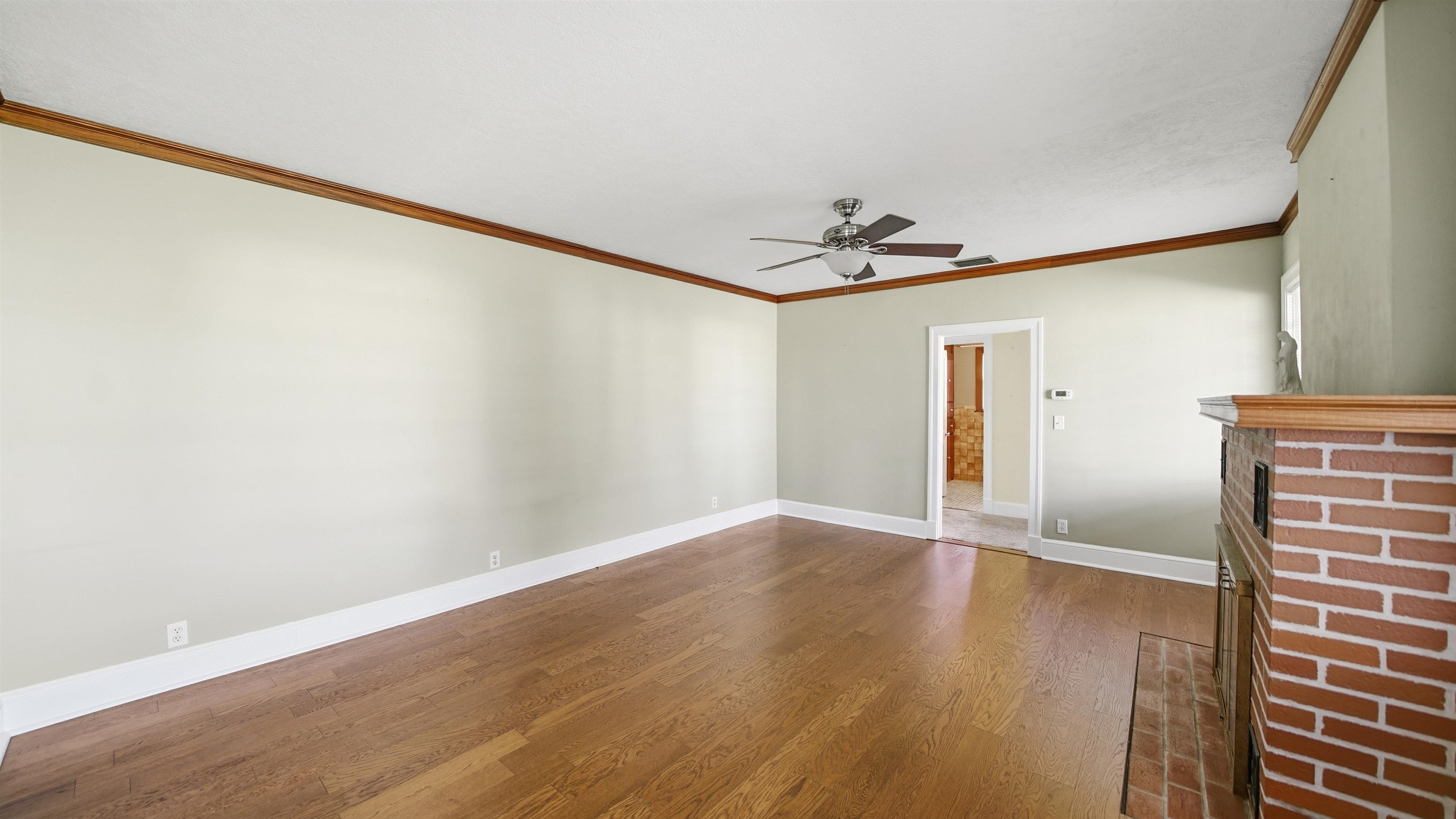 196 Inlet Drive St. Augustine, FL 32080 - Photo 8 of 52 a view of an empty room with wooden floor