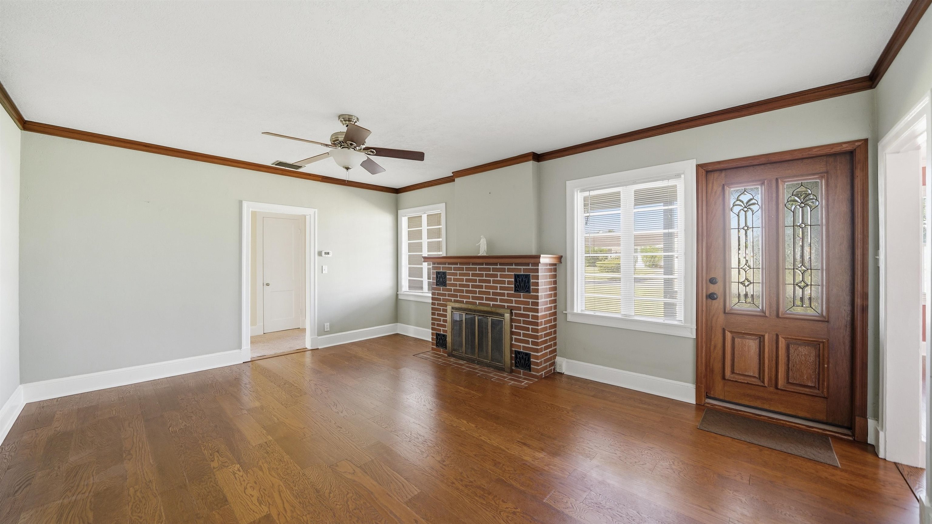 196 Inlet Drive St. Augustine, FL 32080 - Photo 9 of 52 wooden floor in an empty room with a window