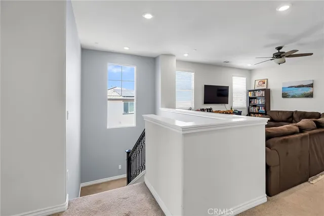 a view of living room with washer and flat screen tv