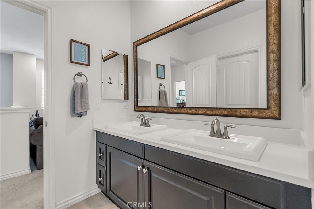 16568 Fleur Boulevard Riverside, CA 92503 - Photo 24 of 48 a bathroom with a sink and a mirror