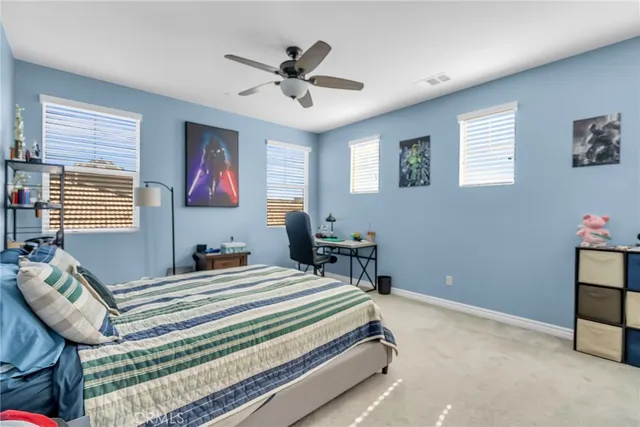 a bedroom with a bed and furniture