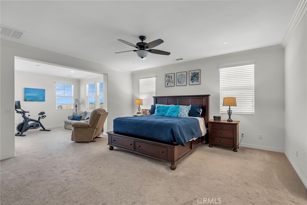 16568 Fleur Boulevard Riverside, CA 92503 - Photo 27 of 48 a bedroom with a bed and furniture