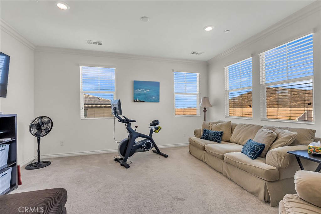 16568 Fleur Boulevard Riverside, CA 92503 - Photo 28 of 48 a view of a livingroom with workspace and a couch