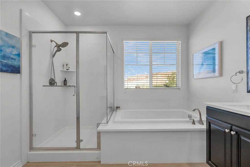 16568 Fleur Boulevard Riverside, CA 92503 - Photo 30 of 48 a bathroom with a bathtub and a shower
