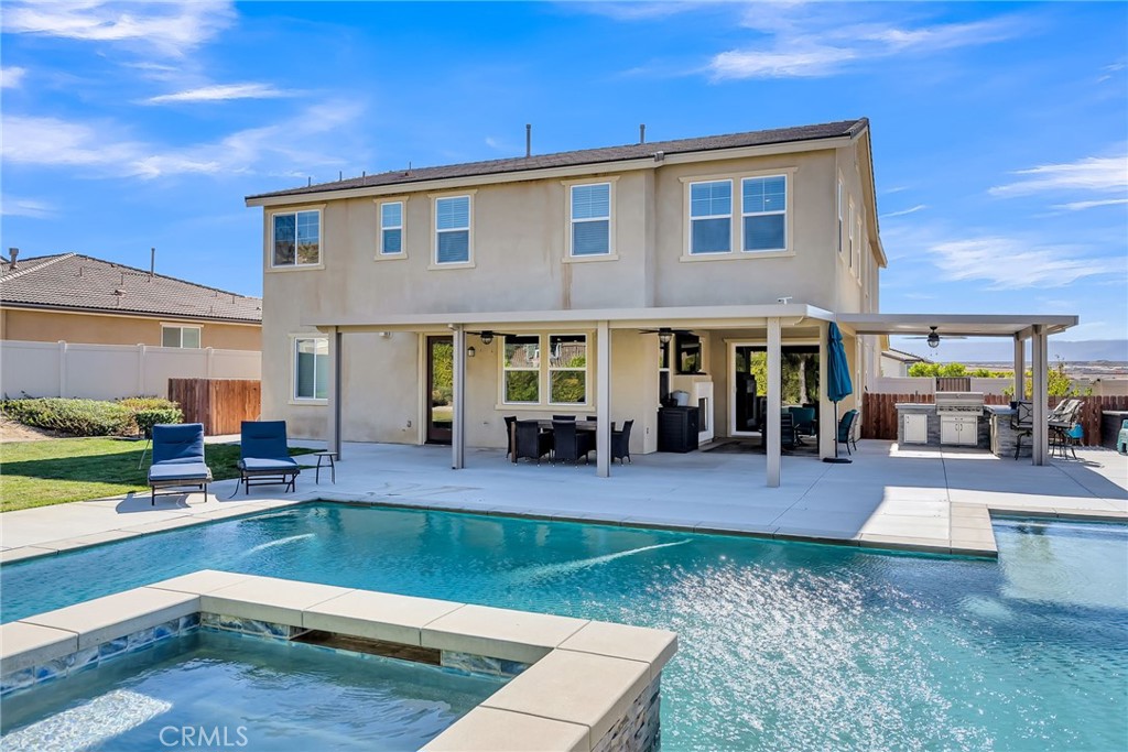 16568 Fleur Boulevard Riverside, CA 92503 - Photo 38 of 48 a view of a house with swimming pool and sitting area