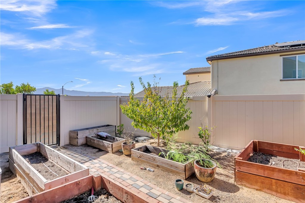 16568 Fleur Boulevard Riverside, CA 92503 - Photo 43 of 48 a picture of a couple of people sitting in a yard