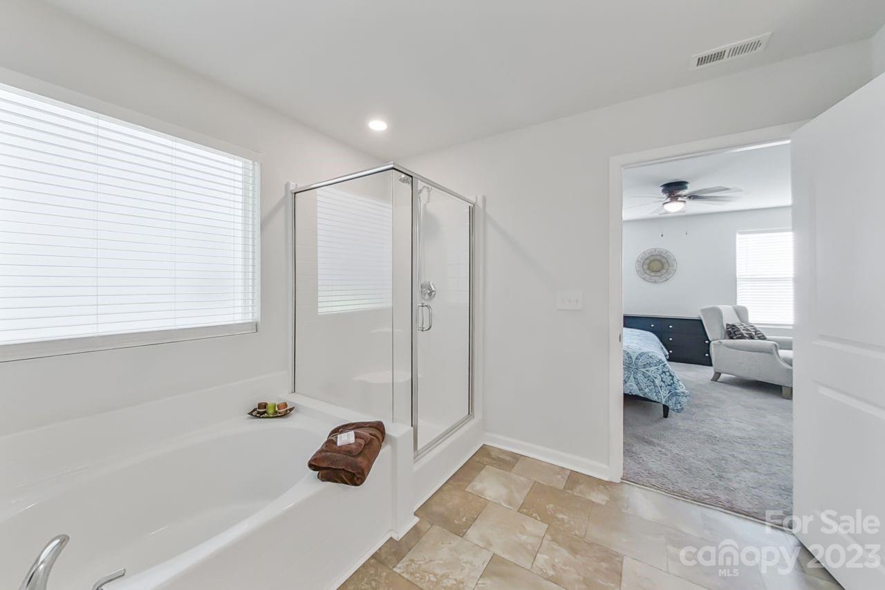 200 Windfall Road Blythewood, SC 29016 - Photo 15 of 20 a bathroom with a tub shower and bedroom view
