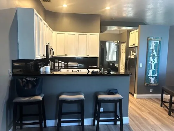 a dining room with furniture and window