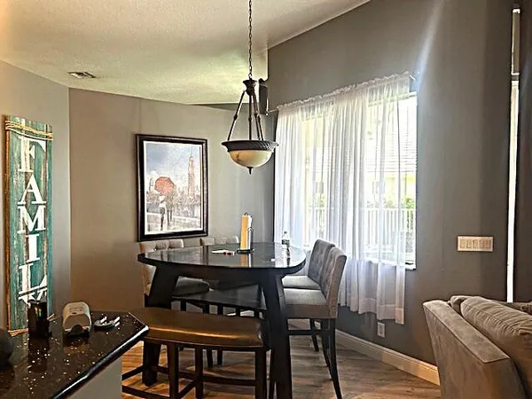 a living room with furniture and large windows