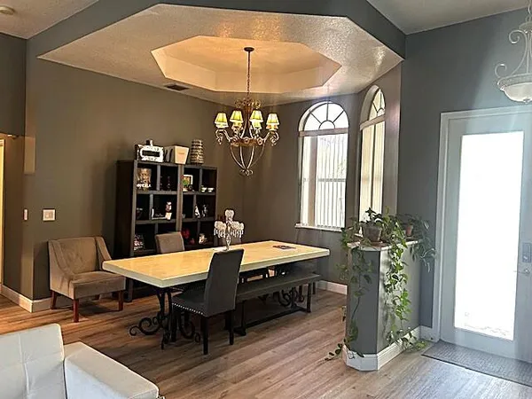 a living room with kitchen island granite countertop furniture and a large window