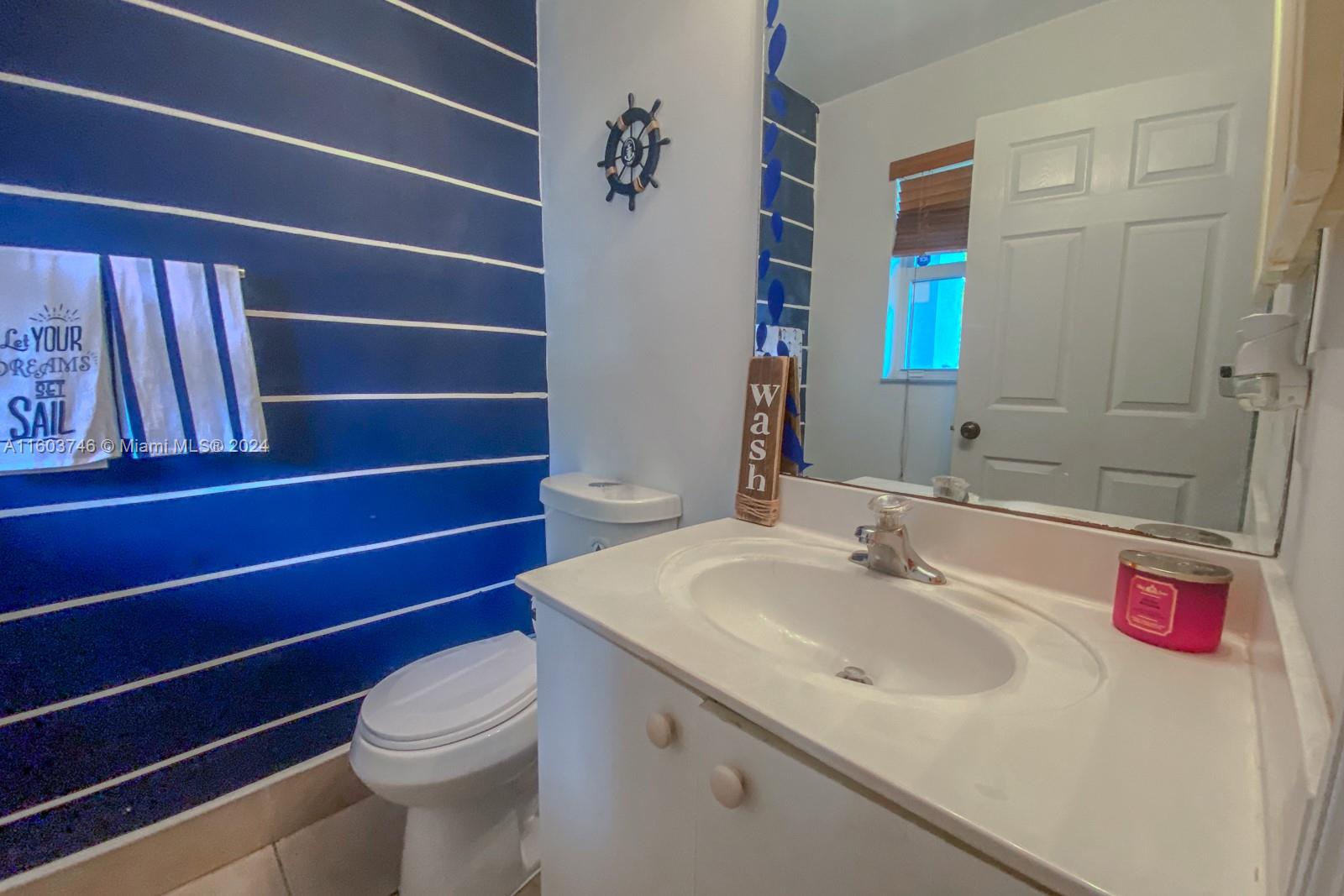 1401 Southeast 20th Road Homestead, FL 33035 - Photo 12 of 24 a bathroom with a sink and a toilet