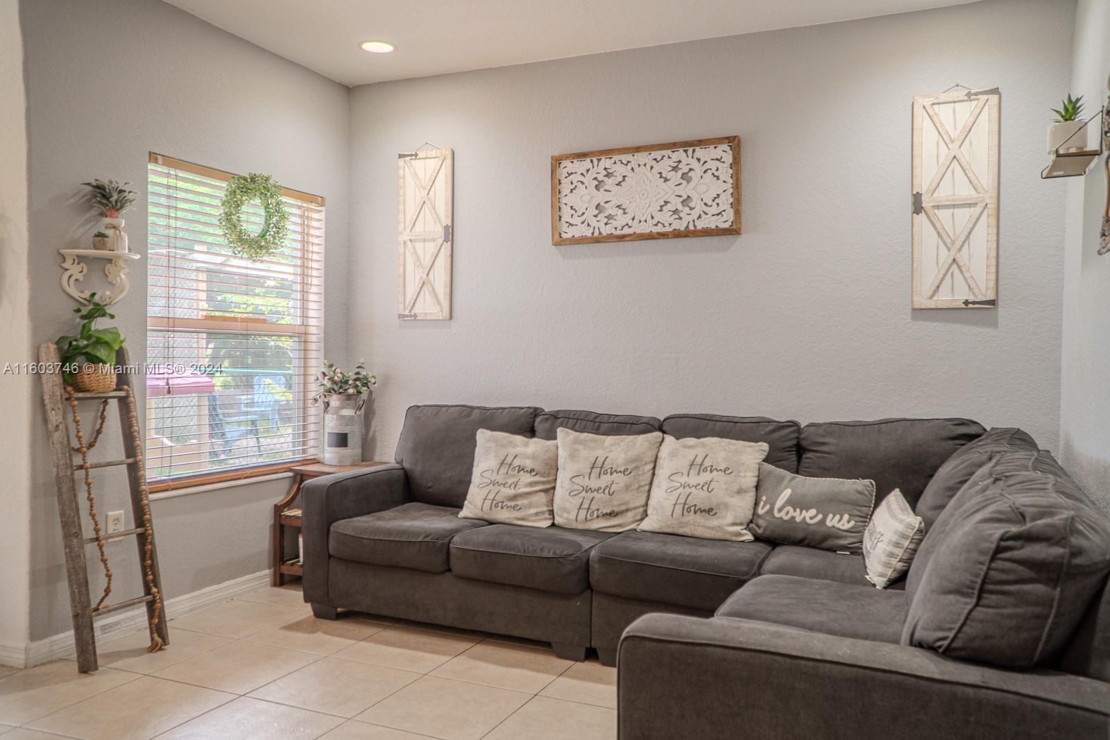 1401 Southeast 20th Road Homestead, FL 33035 - Photo 4 of 24 a living room with furniture and a window