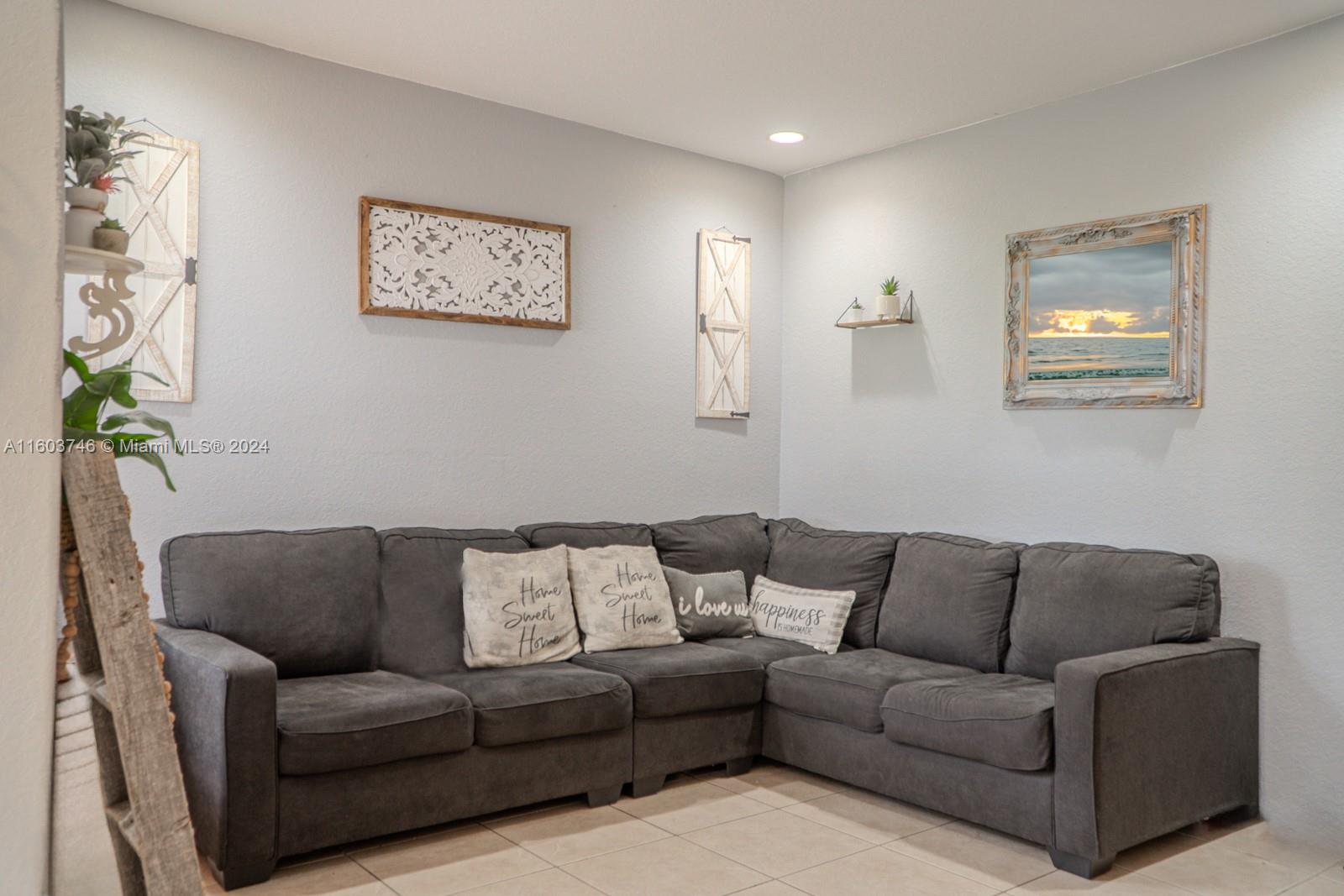 1401 Southeast 20th Road Homestead, FL 33035 - Photo 5 of 24 a living room with furniture and a couch