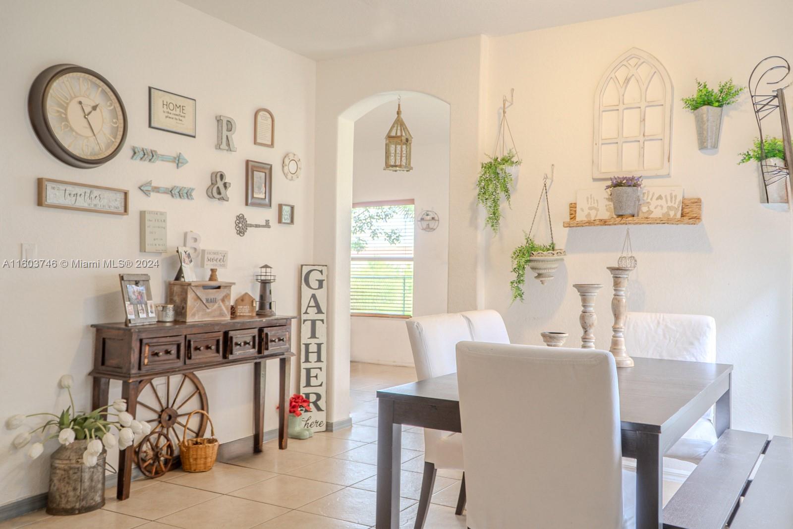 1401 Southeast 20th Road Homestead, FL 33035 - Photo 8 of 24 a very nice looking room with many windows