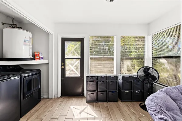 a view of a livingroom with furniture and windows