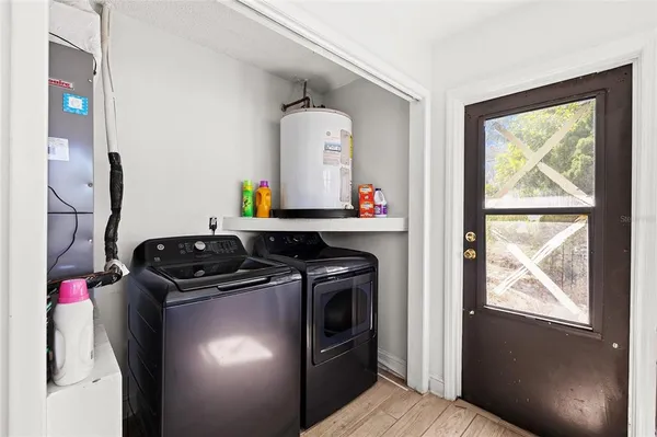 a kitchen with a stove and a mirror