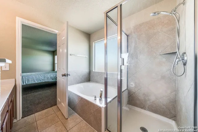 a bathroom with a tub and a shower