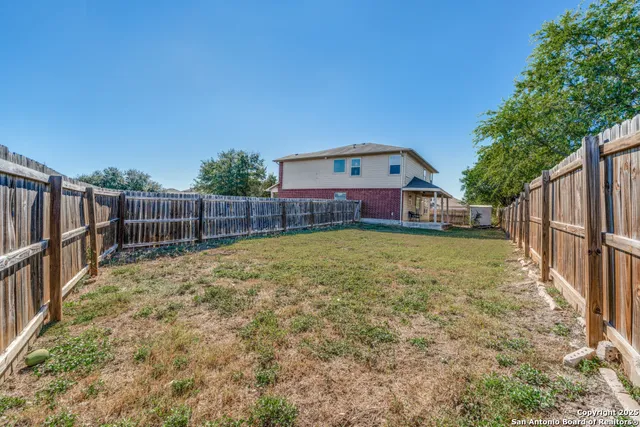 a view of a backyard with a small cabin