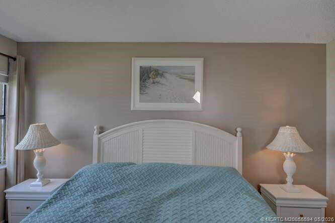 1950 Southwest Palm City Road, Unit 3209 Stuart, FL 34994 - Photo 20 of 64 Primary ensuite bedroom with water view!