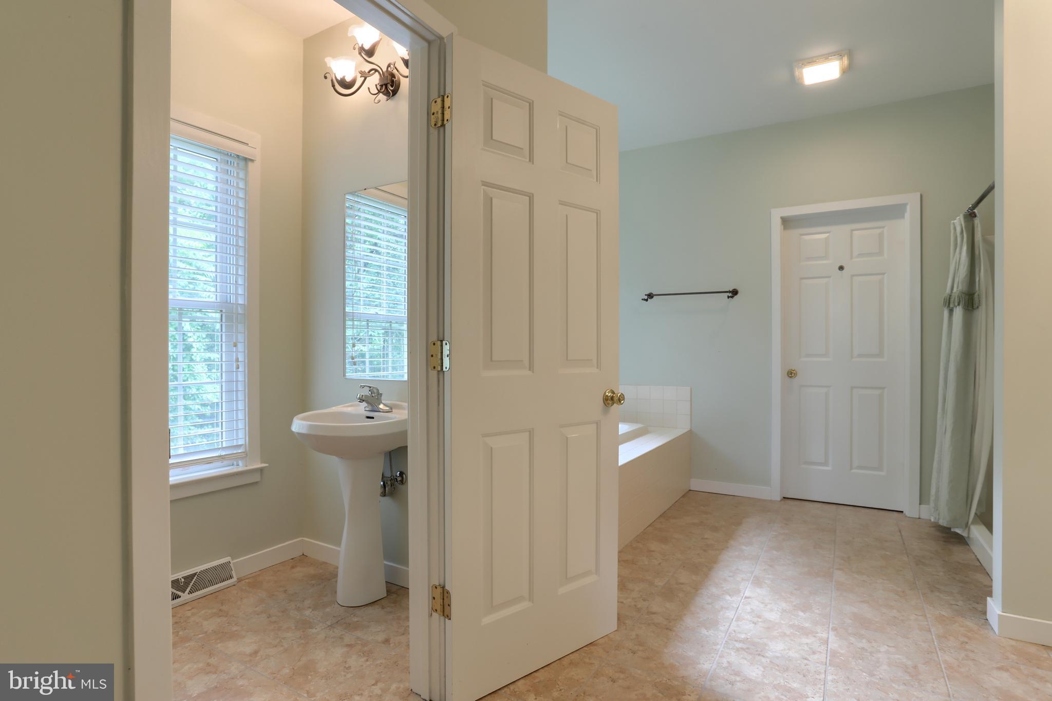 146 Rexmont Road Lebanon, PA 17042 - Photo 23 of 55 Primary bath, water closet, tile flooring