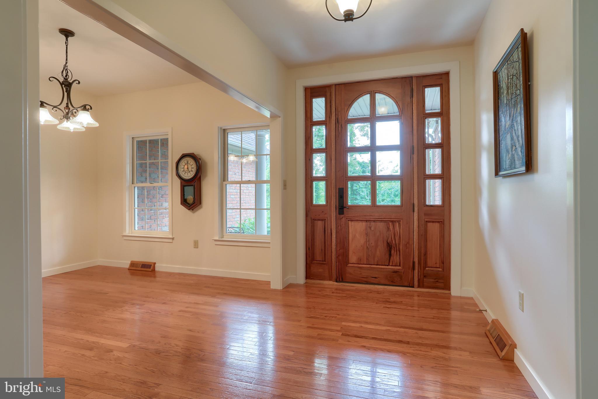 Main entrance with custom wood door, leaded glass