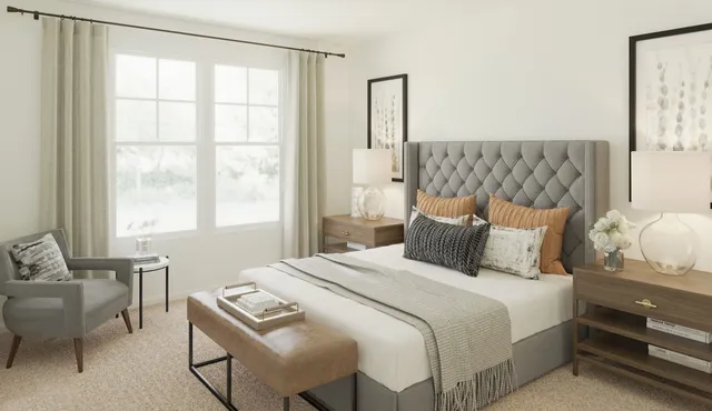 a bedroom with a bed and a window with chair