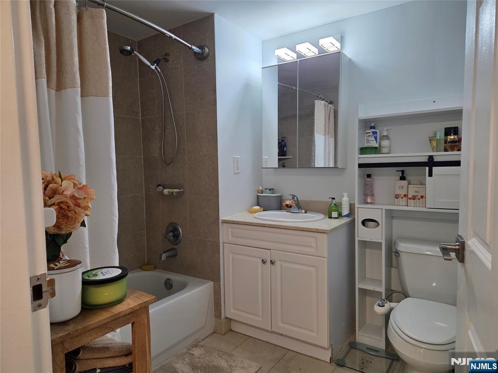 100 Old Palisade Road, Unit 803 Fort Lee, NJ 07024 - Photo 12 of 16 a bathroom with a sink a toilet and shower