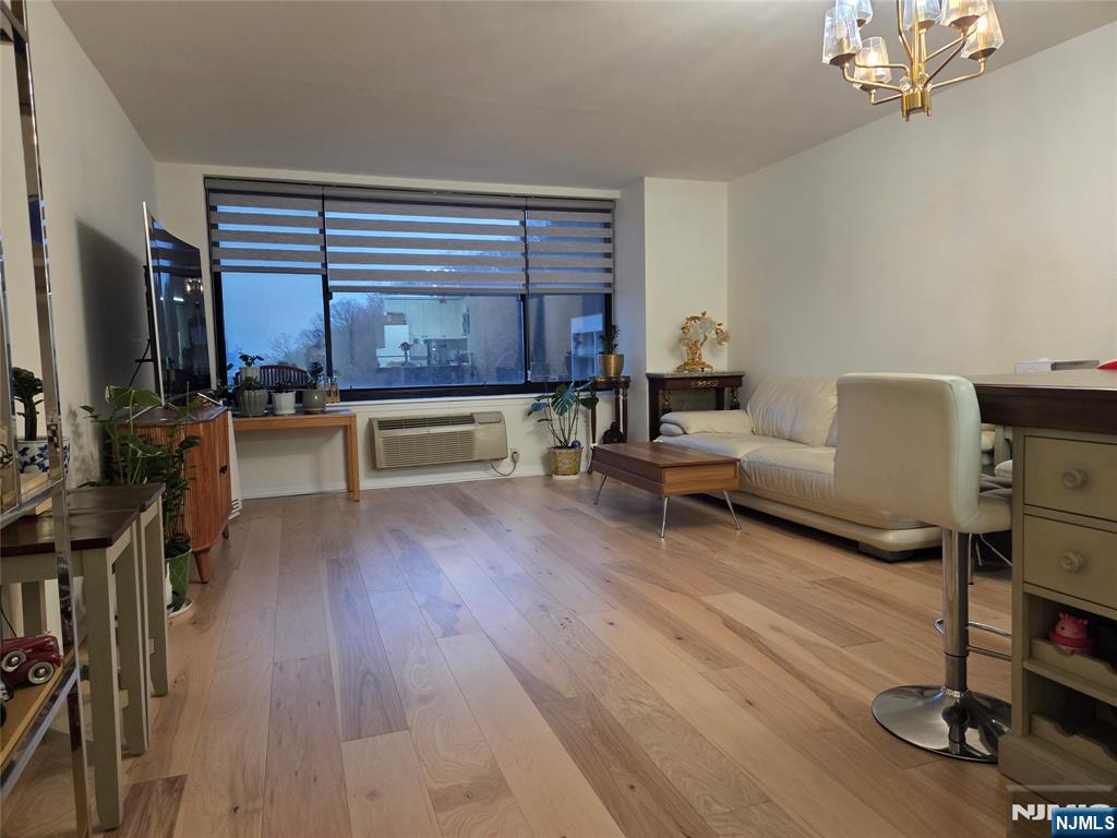 100 Old Palisade Road, Unit 803 Fort Lee, NJ 07024 - Photo 7 of 16 a living room with furniture and a flat screen tv