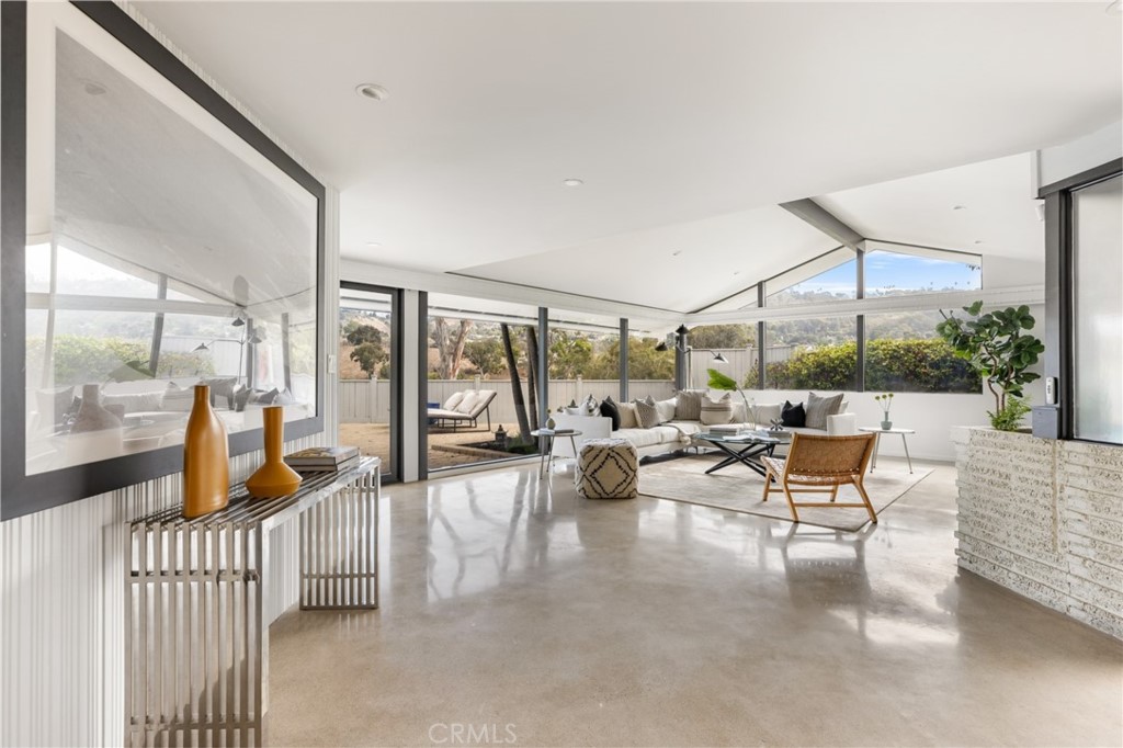 Palos Verdes Peninsula, 90274 - Photo 17 of 47 a living room with furniture and a large window
